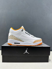 Side profile of a white Jordan Air Jordan 3 Retro sneaker with orange accents and elephant-print panels, displayed on a Jordan shoebox.