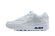 Side view of a white Nike Air Max 90 sneaker with blue accents and a visible Air unit.