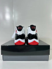 Rear view of the pair showing black heel collars, white heel panels, red branding, and red outsole sections.