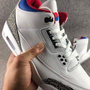 Close side view showing the textured white upper and layered lacing area.