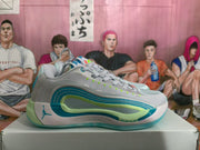 Side profile showing the layered blue and green detailing, Jumpman logo, sculpted midsole, and teal outsole.