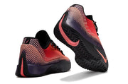 Rear and outsole view of coral and purple Nike S.T. Flare EP sneakers.