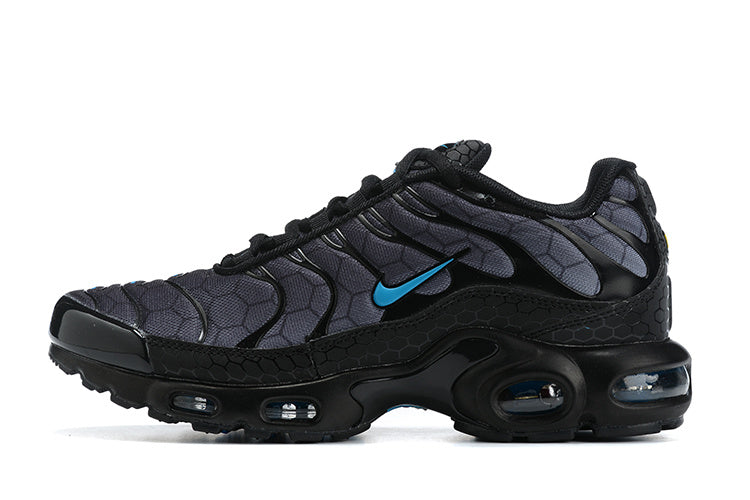 Side view of a black and charcoal Nike Air Max Plus sneaker with blue accents.