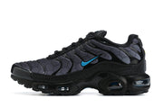 Side view of a black and charcoal Nike Air Max Plus sneaker with blue accents.