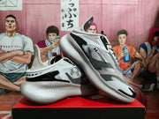 Angled side view showing the Under Armour logo, black overlays and textured white sole.