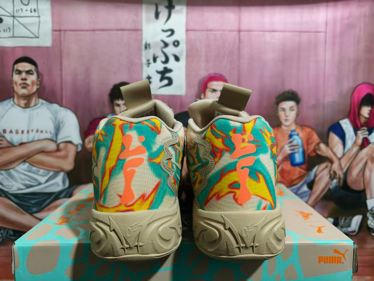 Rear view of Puma sneakers showing the colorful floral-style heel pattern, cream outsole, and patterned Puma shoe box.
