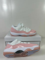 Pink and white Jordan sneakers shown from the side and outsole, with patterned traction sections visible.