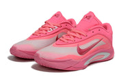 Pair of pink Nike A'ja Wilson 1 basketball shoes shown from a front three-quarter angle.