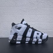 Side profile of a black and white Air More Uptempo sneaker.