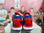 Rear view showing blue heel panels, red heel sections, and white midsoles.