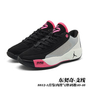 Pair of black, white and pink Jordan 8812 basketball shoes in a front three-quarter view.
