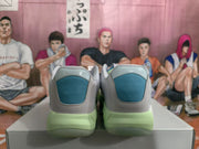 Rear view showing blue heel panels and pale green midsoles