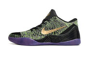 Side view of a black, green, and purple low-top shoe.