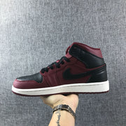 Outer side profile of the burgundy and black high-top sneaker.