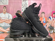 Angled view of the pair showing the high-top profile, textured side panels, straps and black outsole.