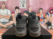 Rear view showing heel pull tabs, textured heel panels, and visible Nike Zoom branding.