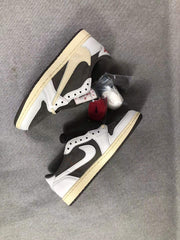 Two sneakers arranged from above, showing contrasting Swoosh colors and bundled white, red, and black laces.