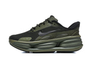 Side view of an olive and black Nike running shoe with a dark Swoosh and sculpted sole.