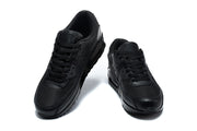 Front view of a pair of black Nike Air Max 90 sneakers.