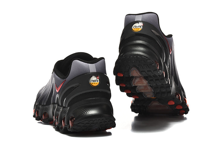 Rear and outsole views of black and grey Nike Air Max DN8 sneakers with red accents.