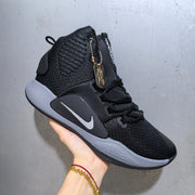 Three-quarter side view showing the Nike Hyperdunk upper, side branding, lace system, and grey midsole.