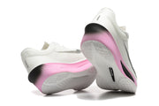 Rear and outsole views of white Nike Zoom Fly 6 shoes with pink, black, and white details.