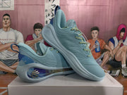 Pair of blue basketball sneakers shown at an angled view