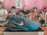 Side view of gray Nike basketball sneakers with blue accents and a translucent blue outsole