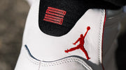 Close-up of the black heel tab with red number detail and red Jordan logo.
