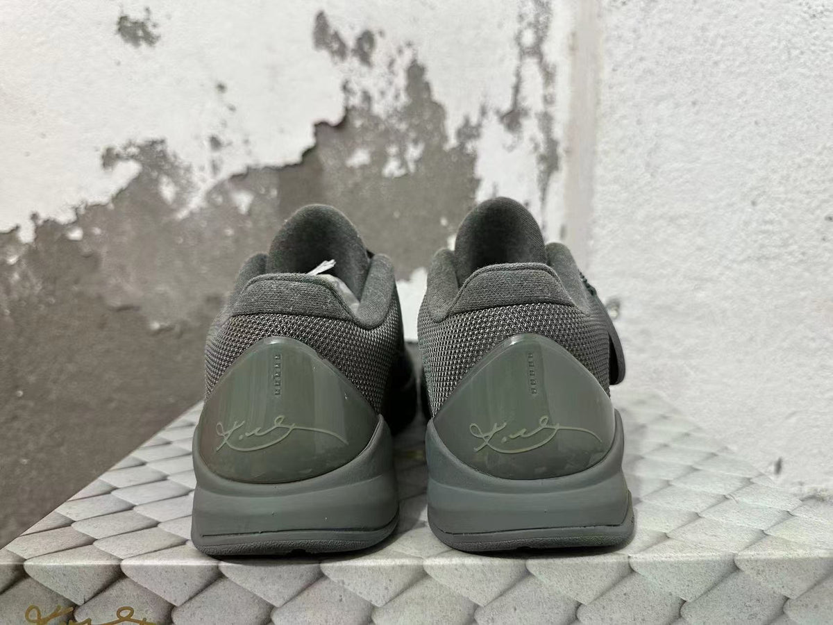 Rear view of dark gray Nike Kobe 5 FTB basketball shoes showing signature heel details.