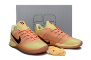 Pair of orange and yellow Nike Sabrina 3 shoes shown from the front