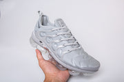 Single silver-gray Nike TN-4 sneaker shown from a front-side angle