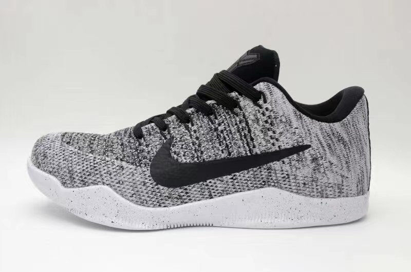 Side view of black-and-white Nike Kobe 11 low-top sneakers