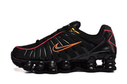 Side view of a black Nike Shox TL sneaker with orange Swoosh and column-style sole