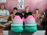Rear view showing GT heel emblems and mint-green outsoles
