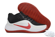 Black, white and red Nike Precision 8 shoe displayed beside its red patterned outsole.