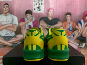 Rear view showing the yellow-and-green heel panels and padded collars.