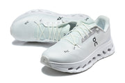 Pair of white On Cloudmonster 3 lace-up shoes shown from above and at an angle.