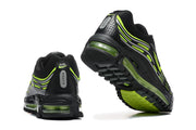 Rear and outsole views of black Nike Air Max sneakers with volt details