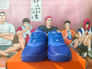 Front view of the blue Nike basketball sneakers showing the laces, perforated toe panels, padded tongues, and textured forefoot.