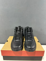 Front view of the black high-top sneaker pair showing the laces, tongues, and rounded toe panels.