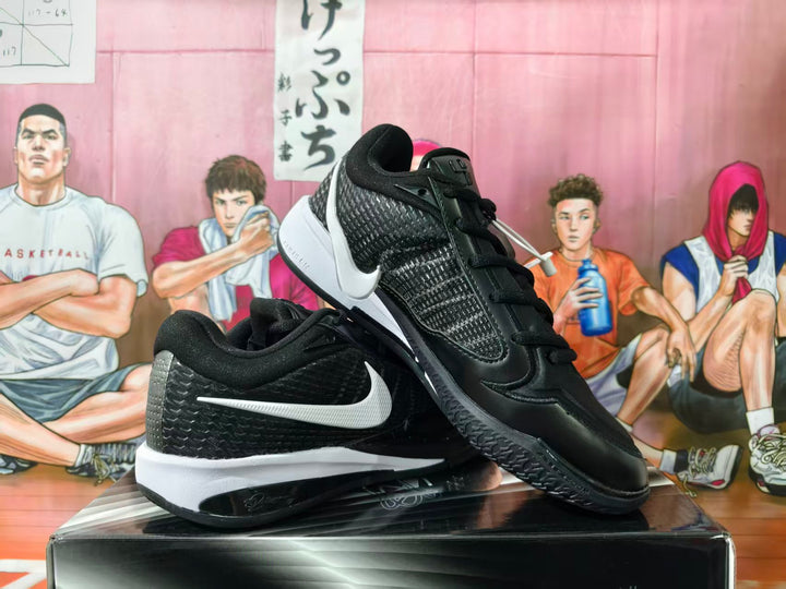 Pair of black Nike basketball sneakers with white Swooshes, shown from side and angled views.