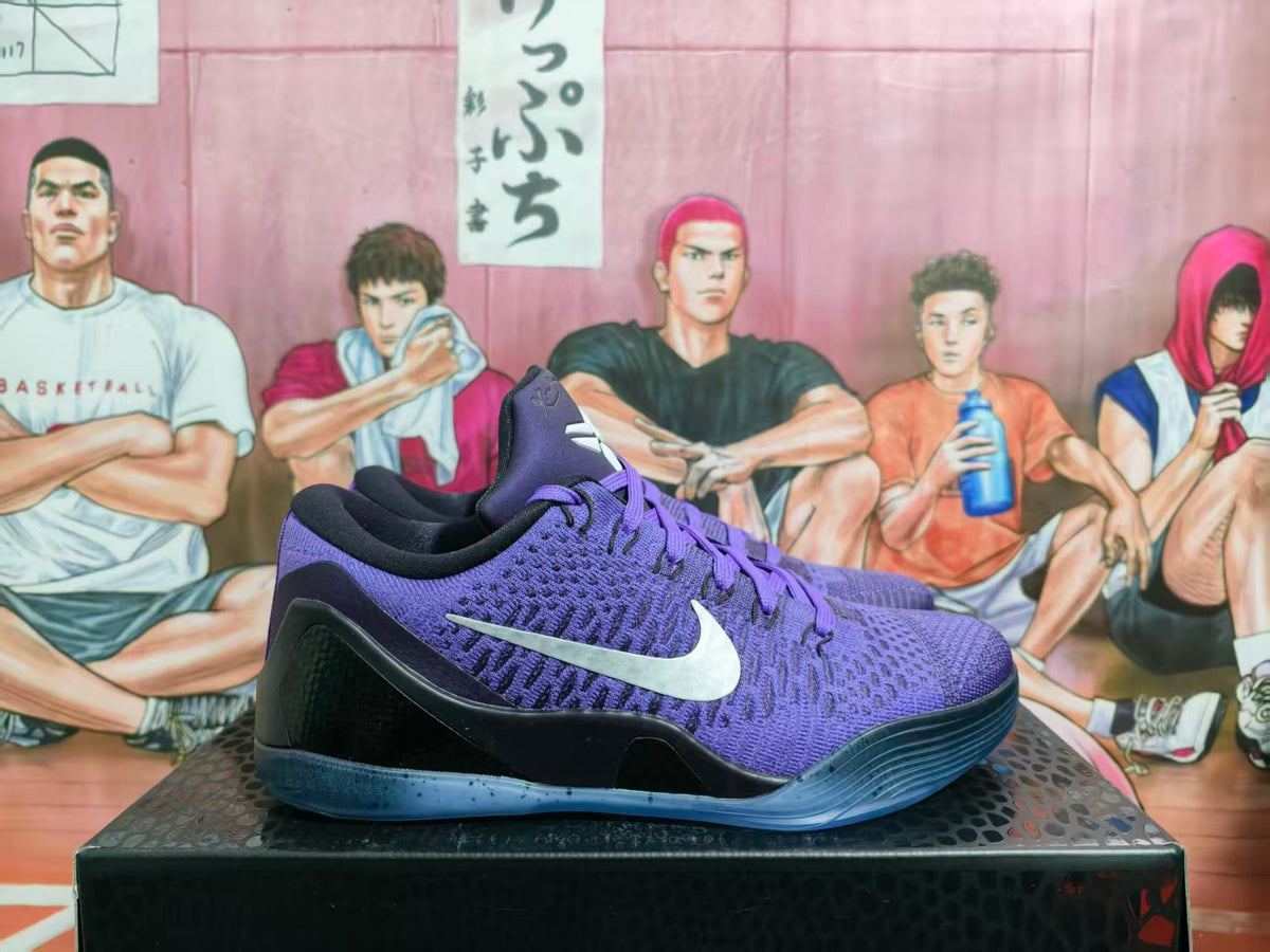 Pair of purple and black Nike Kobe basketball shoes shown from the side
