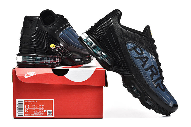 Black and blue Nike Air Max Plus III Paris sneakers displayed with a red shoebox; the box label shows Air Max Plus III.