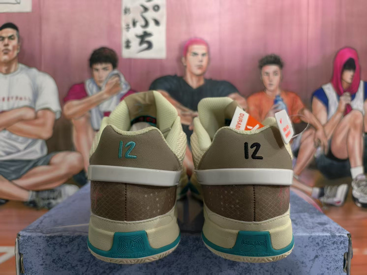 Rear view of coconut-milk and teal Nike basketball sneakers showing brown heel panels, contrasting heel details, and textured outsole sections.