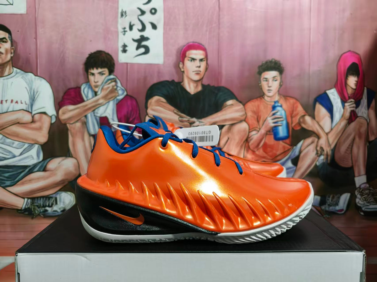 Side view of orange and blue Nike basketball shoes with a black side panel and white outsole