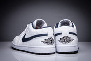 Rear view of the pair showing the Air Jordan winged-ball heel logos and dark outsole edges.