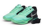 Pair of black and mint-green Nike Sabrina 4 basketball shoes shown from the front and side.