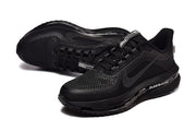Angled view of a pair of black Nike Pegasus Premium shoes.