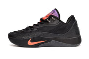 Side view of black Nike S.T. Flare EP basketball shoes with orange branding and purple-orange tongue details.
